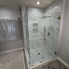 Frameless-Glass-Shower-with-Brushed-Gold-Hardware-in-Westerville-OH 0